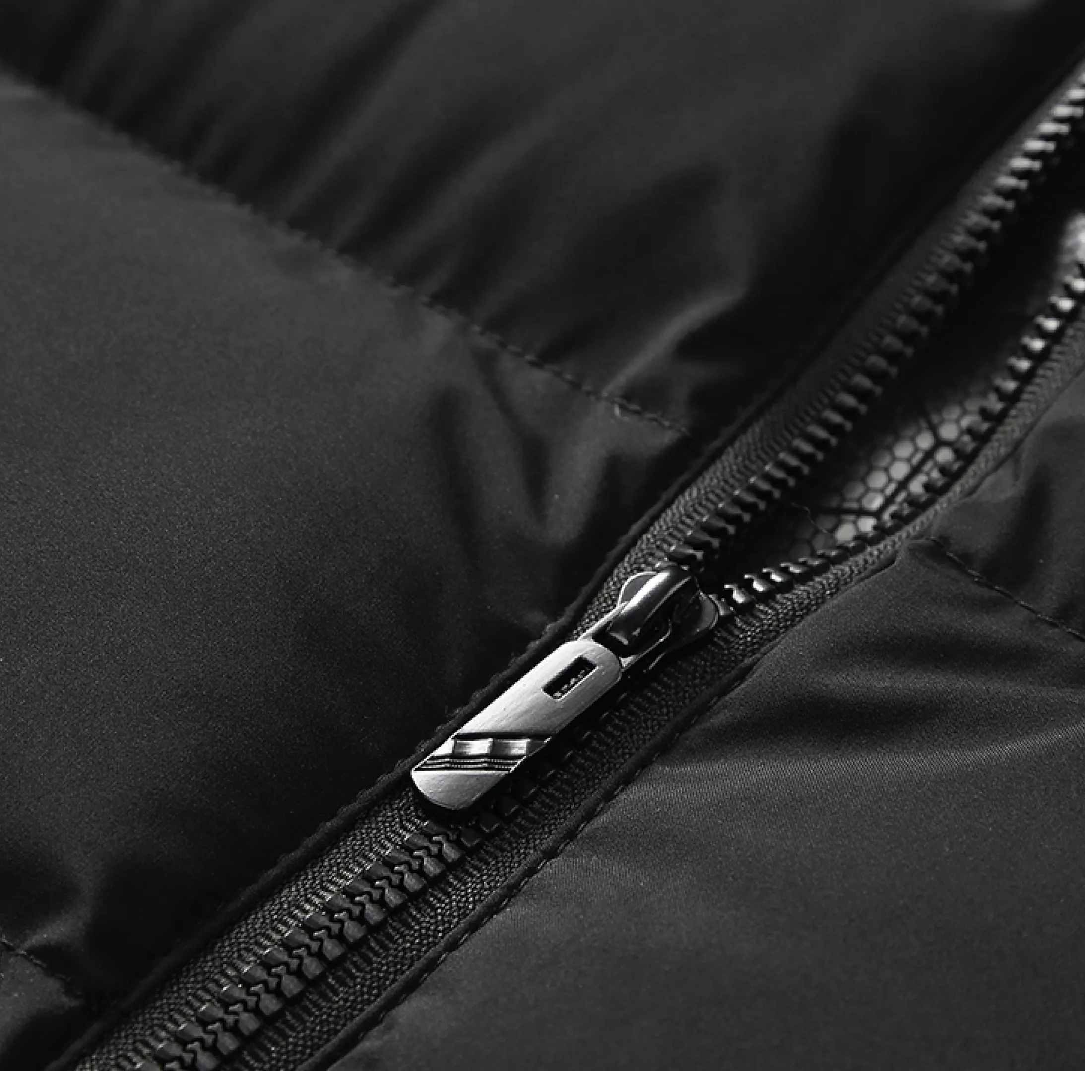 doudoune-sans-manches-chauffante-noire-personnalisable.webp Bodywarmer chauffant personnalisable